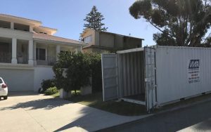 U-Move Australia shipping container on a residential verge.